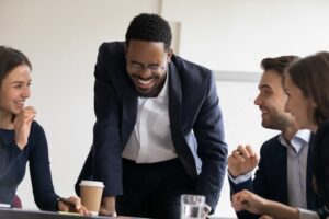 Laughing executives during meeting